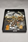 A tray of miscellaneous decorative costume jewellery, to include yellow metal chains and brooches, a