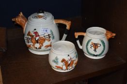 A trio of moulded fox hunting themed ceramics, including teapot sugar and milk jug, PPC England