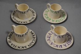 Four Emma Bridgwater coffee cups and saucers of simple design.