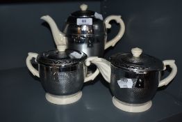 A vintage trio , including teapot, hot water pot and sugar basin, 'Heatmaster, Balmoral'.