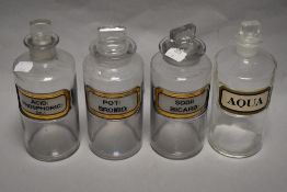 Four 19th/early 20th century chemist/apothecary glass bottles with labels.