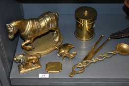 A brass trench art canister with lid, fabricated from shell casing, a lion paperweight, cast horse
