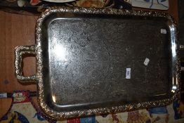 A 19th/20th Century silver plated and galleried serving tray, with embossed foliate design, and
