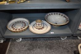 A selection of Mosse pottery ceramics, including flan dishes and bowl.