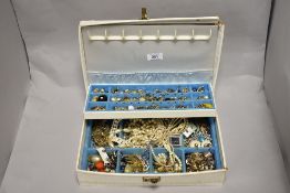 A mid-20th Century jewellery box containing miscellaneous decorative jewellery, including