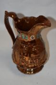 A 19th Century copper lustre jug, hand painted and relief moulded, titled 'Punch', and measuring