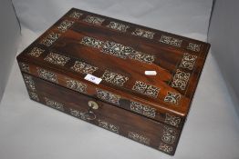 A late Victorian rosewood writing slope, having extensive Mother of Pearl inlaid detailing and