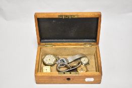An oak dome topped box containing wristwatches by Sekonda, Ingersoll, Yamaha, Services Navigator,