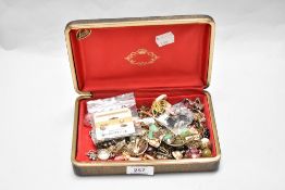 A lustre jewellery box containing miscellaneous costume jewellery, to include Monet clip on