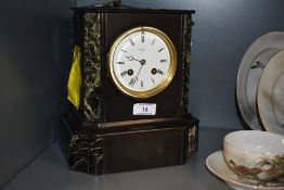 A 19th century marble mantel clock, having brass framed bevelled glass door with roman numerals to