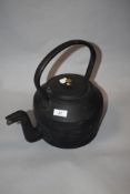 A vintage cast metal eight pint kettle, marked Swain.
