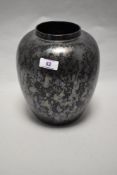 A Poole pottery black vase having mottled lustre glaze.