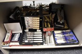 An extensive collection of silver plated cutlery, to include cases of fish knives and forks,
