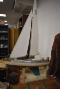 A vintage model boat on stand.