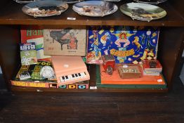 An assortment of vintage toys and board games, including spinning top, Yogi Bear Ludo and more.