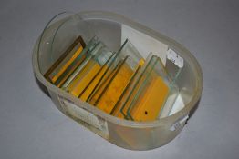 A box of glass panels for carriage clocks.