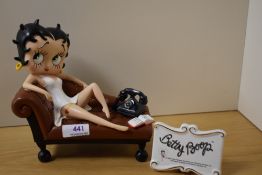A Betty Boop Figurine, Betty by telephone, sold with a Betty Boop Plaque.