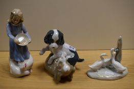 A Royal Doulton figurine, Country Girl and two Nao studies of puppies and geese.