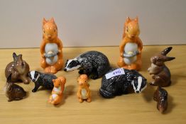 A group of Beswick pottery squirrels, comprising; 1007 standing, 1008 lying and 1008 with nut