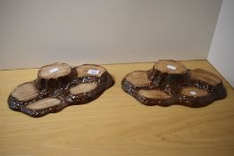 Two Beswick pottery tree trunk display stands.