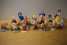 A collection of Royal Doulton Disney Showcase collection figurines and studies.