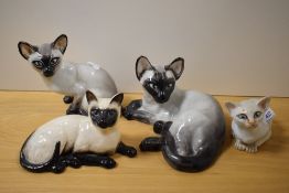 Four Siamese cat studies, including Beswick pottery and Studio six, London, signed M.Short.