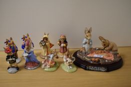 A collection of Royal Doulton Bunnykins studies and a Beswick pottery figurines, Peter and