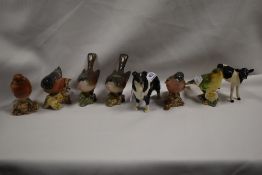 Six Beswick pottery bird studies, a Border Collie and a Friesian calf