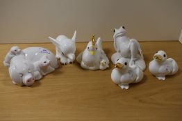 A collection of John Beswick Little Likeables studies, including pig, duck and frog.