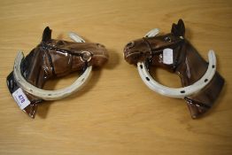 A pair of Beswick pottery horse head wall plaques, Looking through the horse shoe (806 and 807).