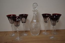 A group of six crystal ruby flash wine glasses and an ovoid crystal glass decanter with stopper