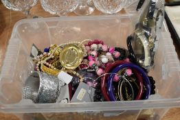 A mixed lot of costume jewellery, bangles, beads and brooches amongst this collection.