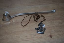 A white metal candle snuffer, the handle stamped 'Denmark', together with a Plustinn Norwegian