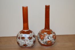A pair of late 19th Century/ early 20th Century Japanese kutani bottle vases, measuring 25cm tall