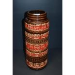 A mid-20th Century West German Scheurich vases, of cylindrical form, in red/brown glaze,