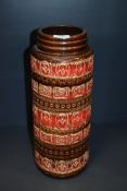 A mid-20th Century West German Scheurich vases, of cylindrical form, in red/brown glaze,