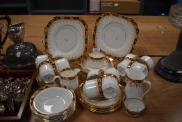 An assortment of part tea services, all in the Imari pallet, including cups and saucers, jugs, bowls