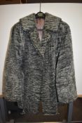 A vintage ladies fur coat.