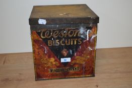 A vintage Weston's Biscuits advertising tin, measuring 24cm x 24cm x 23cm