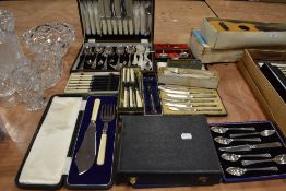 An assortment of boxed cutlery and a canteen of knives, forks and spoons.