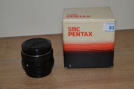 An SMC Pentax 1:1, 8 55mm lens no.1187021, boxed