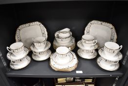 A Melba china tea set, decorated with a Neo-classical design and heightened with gilding