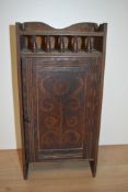 A late 19th Century pokerwork cabinet, with galleried upper section, and stylised foliate design