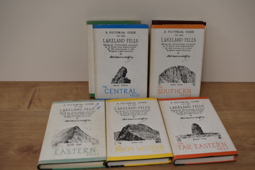 Seven editions of A pictorial guide to the Lakeland fells, by A Wainwright, books one to seven.