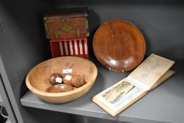 Two antique carved spool holders, a turned cherry wood bowl, a cigar box in the form of a chest,a