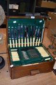 A 20th century mahogany canteen with a collection of boned handled John hall cutlery.