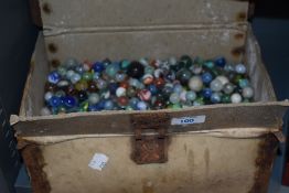Over five kilograms of vintage and antique marbles, housed in a vintage Goodyear advertising box.