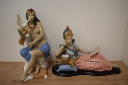 Two Spanish Artesania porcelain figural ornaments, in Egyptian dress, the tallest measuring 37cm