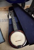A vintage banjo ukulele, labelled Keech, with impressed marks and impressed signature to reverse