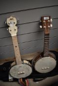 Two modern banjo ukuleles, including Aklot